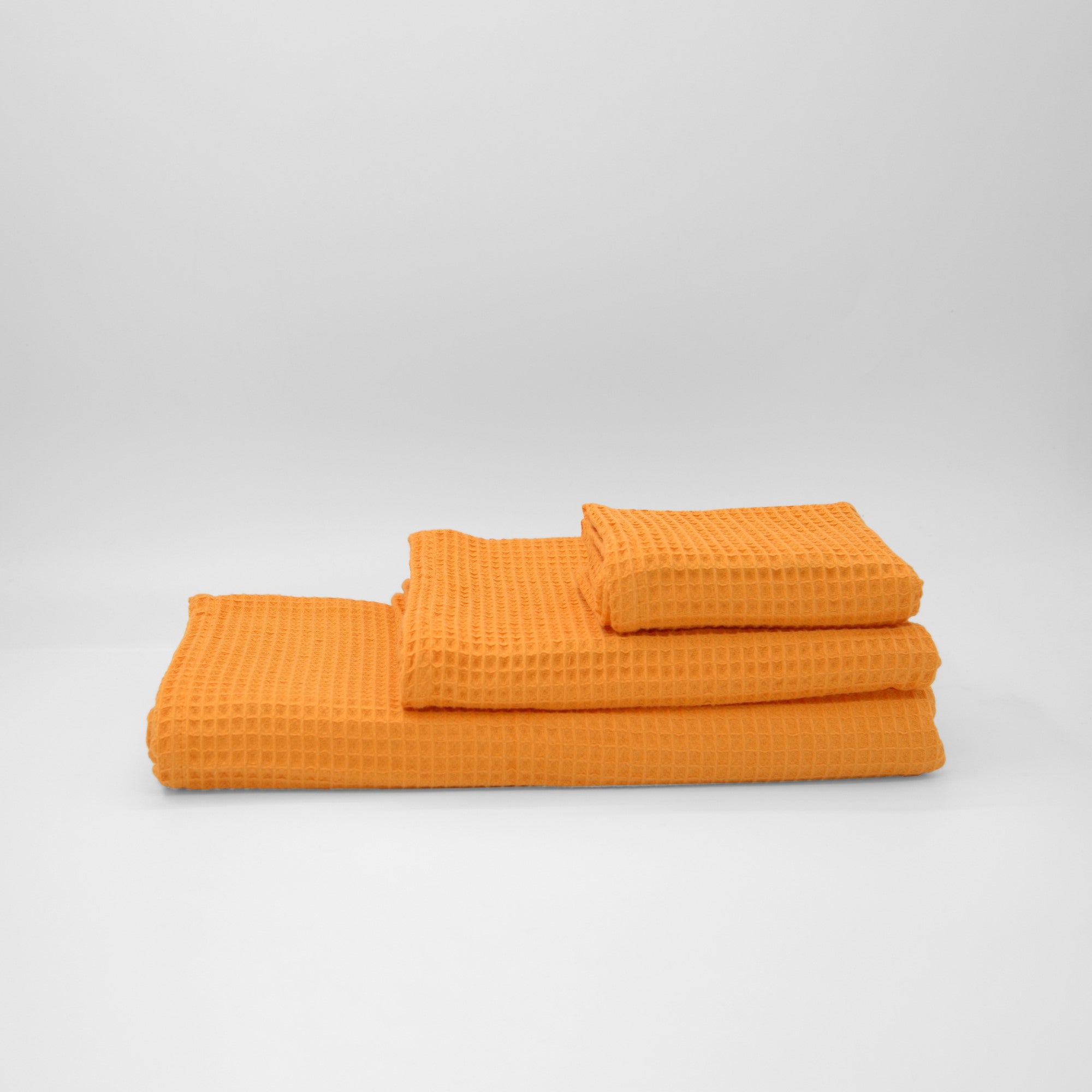 Serviette gaufrée 100 % coton orange clair